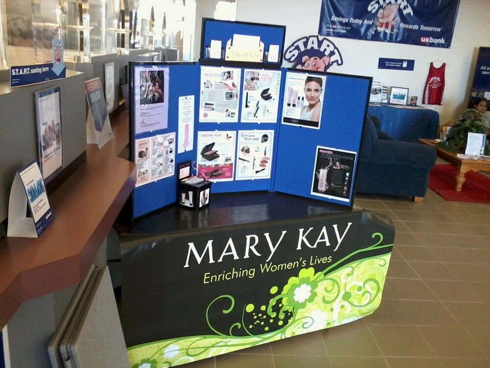 A mary kay sign is displayed in a lobby