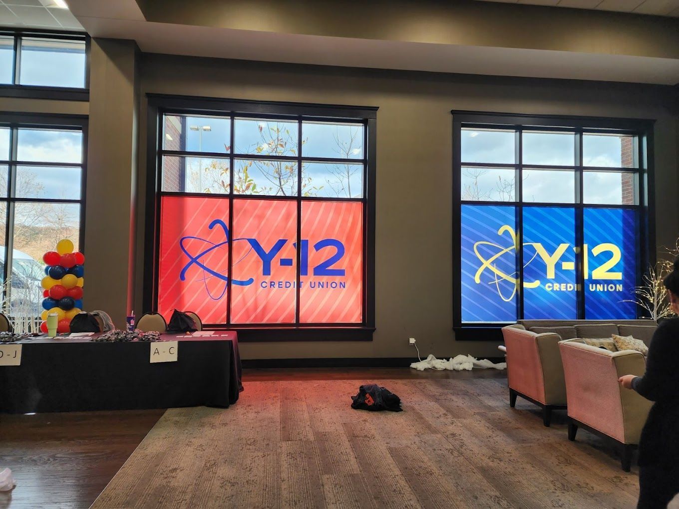 A room with a lot of windows and a sign that says y-12