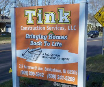 A sign for tink construction services llc bringing homes back to life