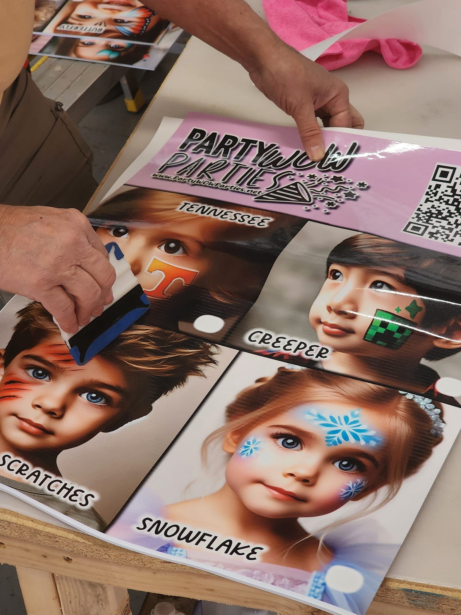 A person is applying face paint to a child 's face