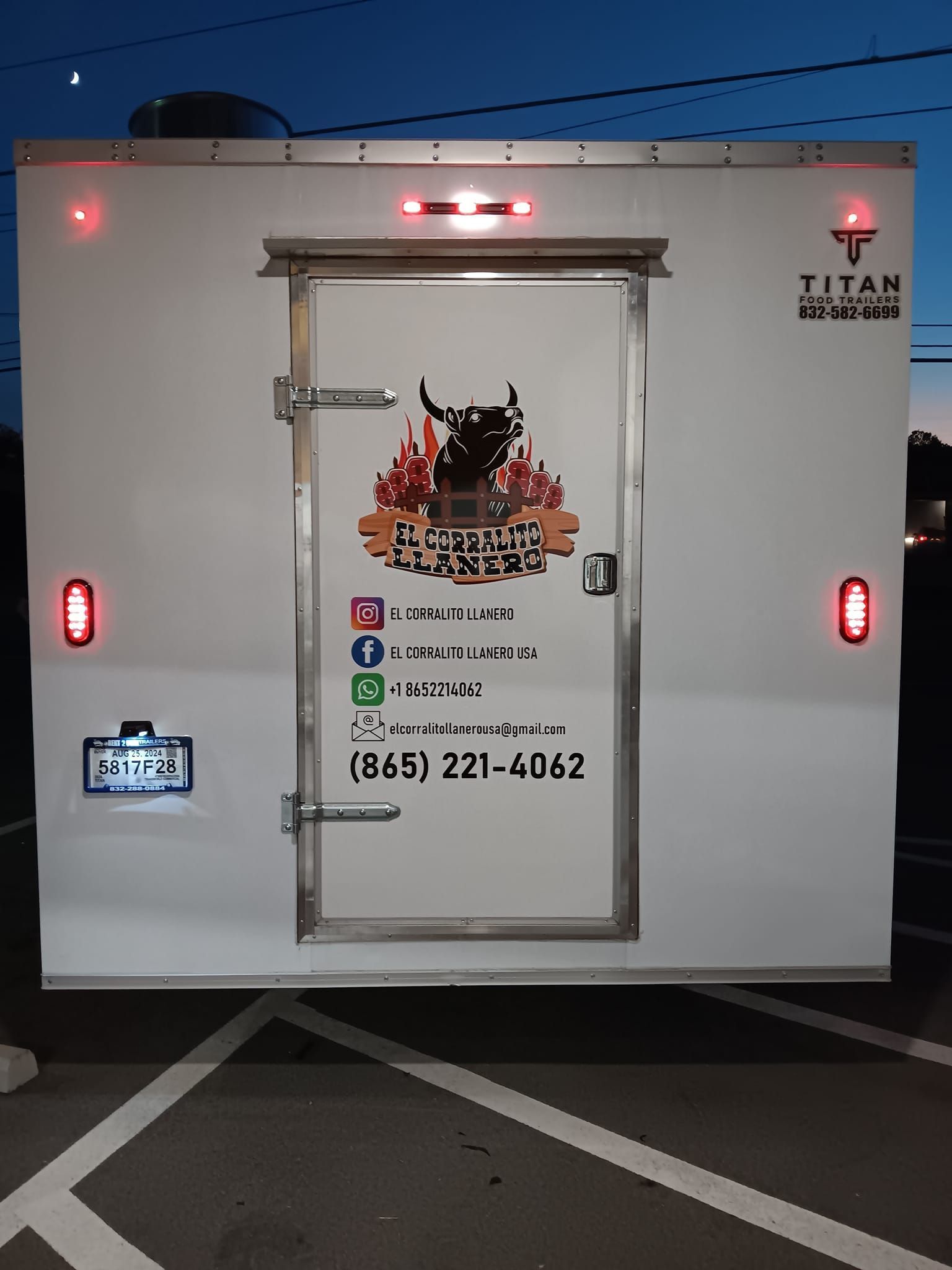 A titan trailer is parked in a parking lot