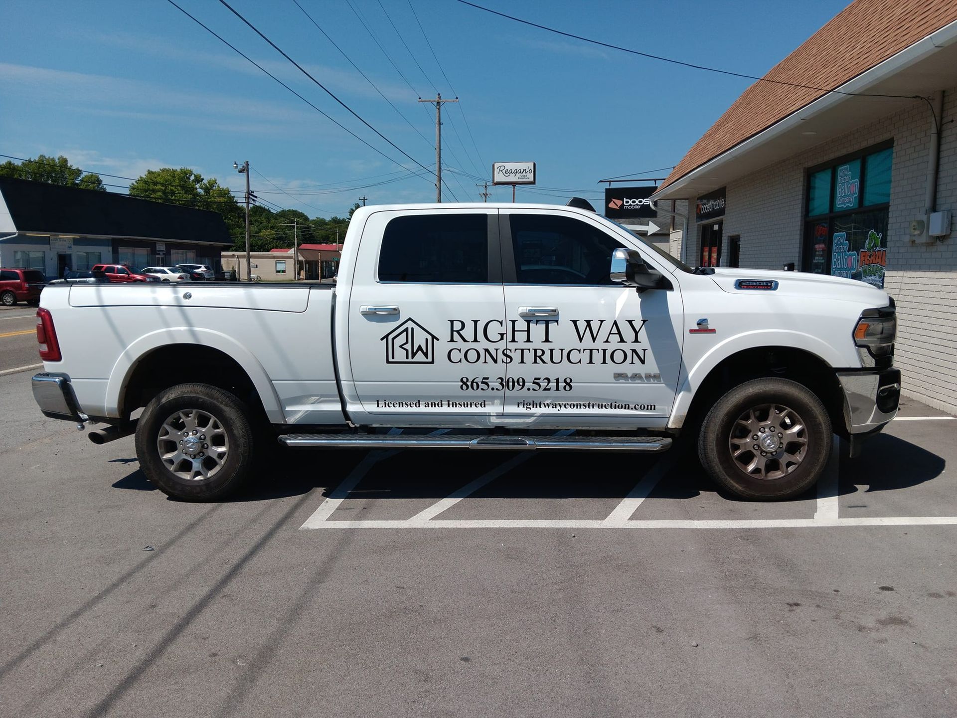 A white truck from right way construction is parked in a parking lot