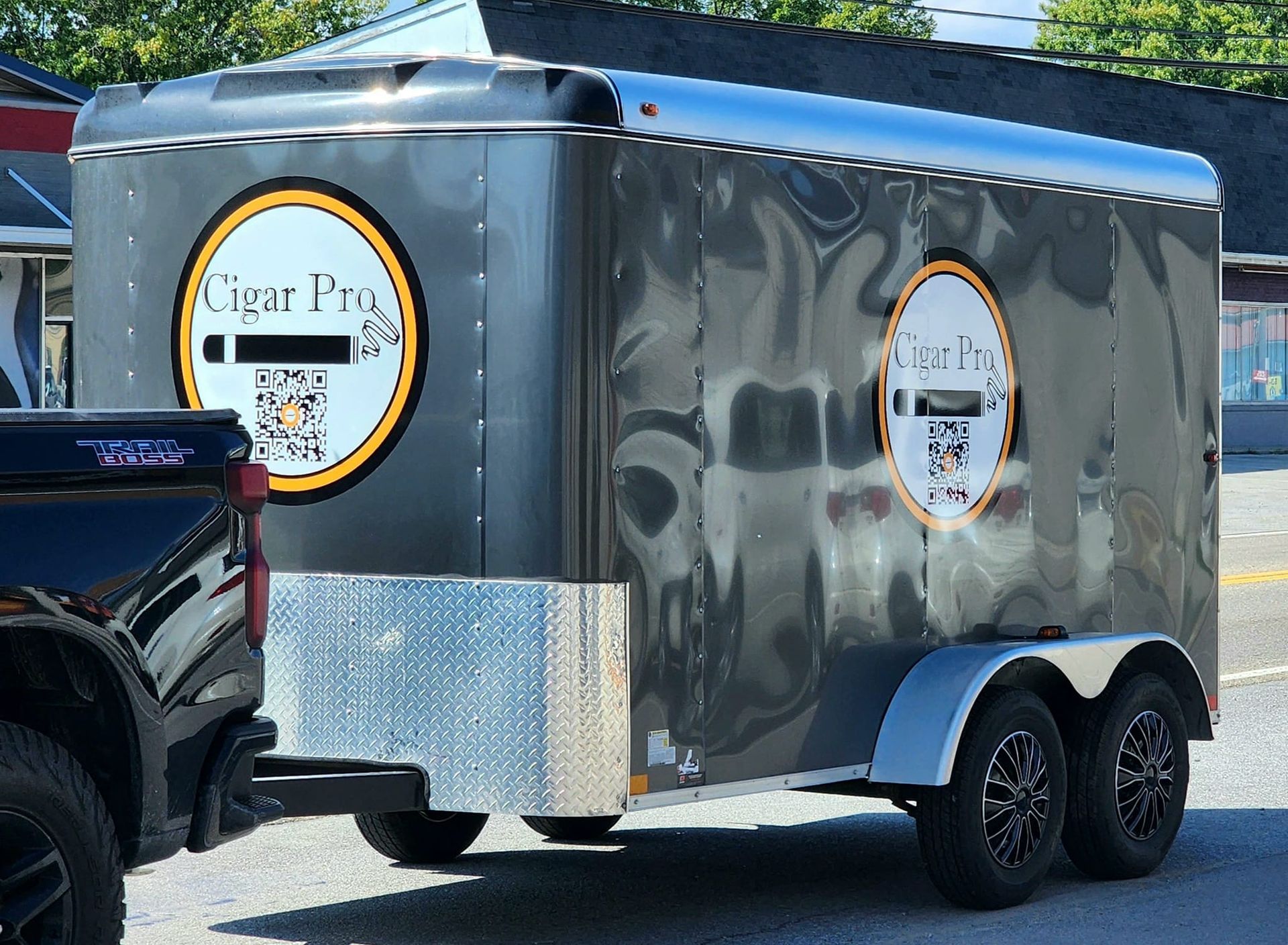 Enclosed trailer with vinyl logo on the side.