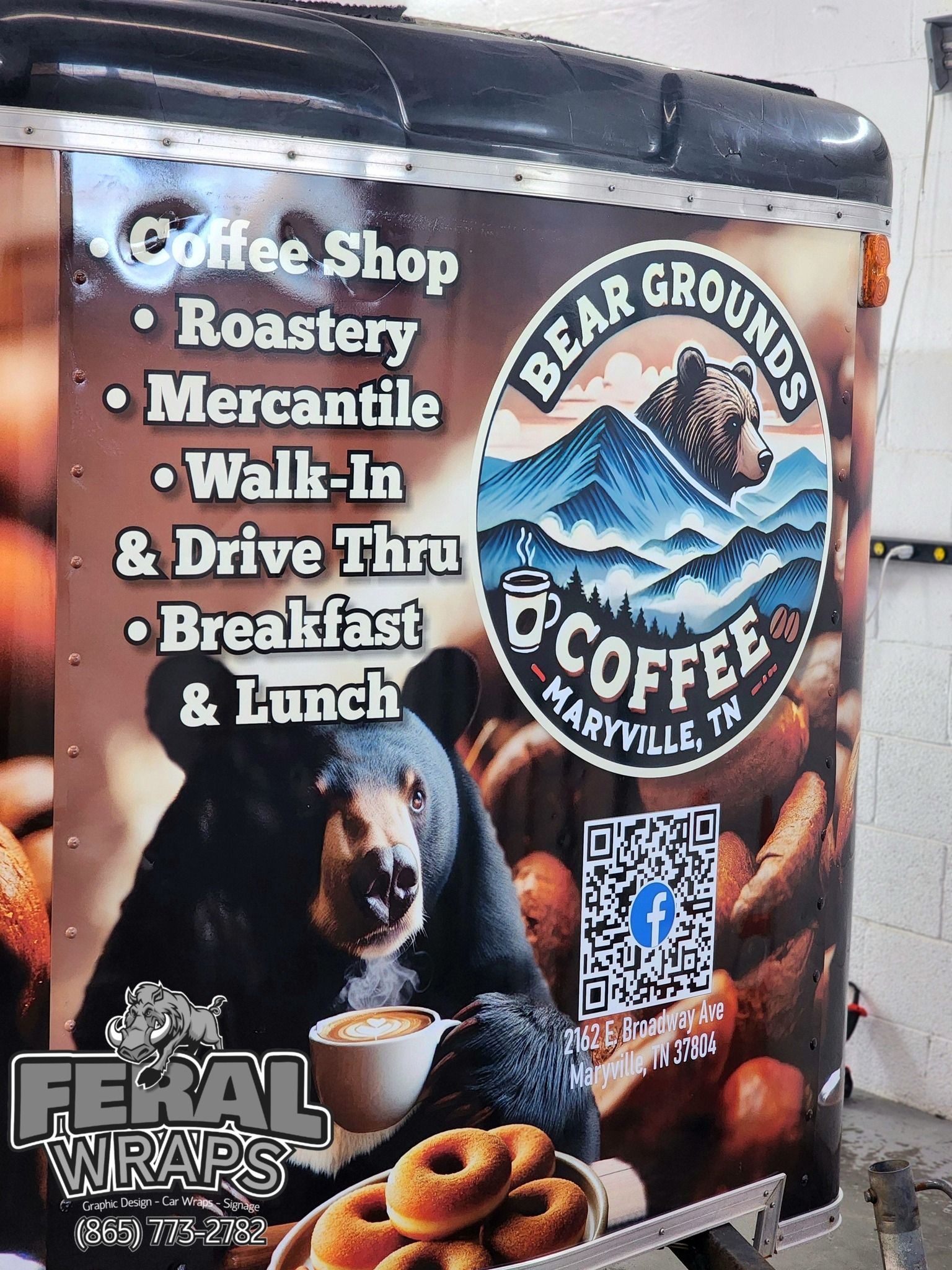 A trailer with a bear on it that says bear grounds coffee