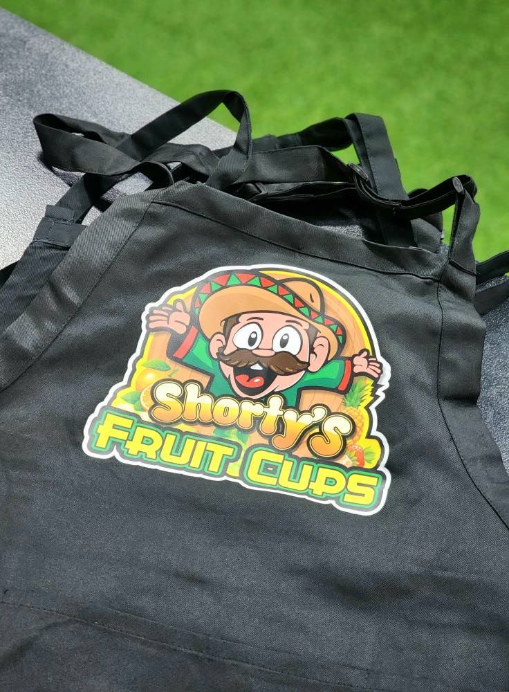 A black apron with the logo for shorty 's fruit cups on it