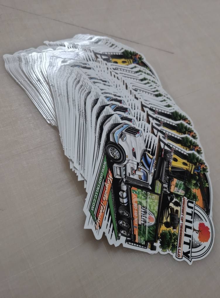 Stack of die-cut stickers featuring a truck and the word 