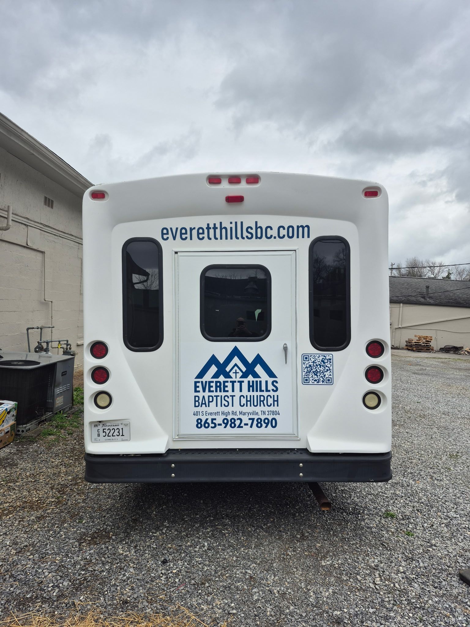 Back of a white bus with 