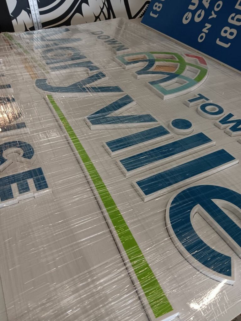 A large sign is sitting on top of a table.