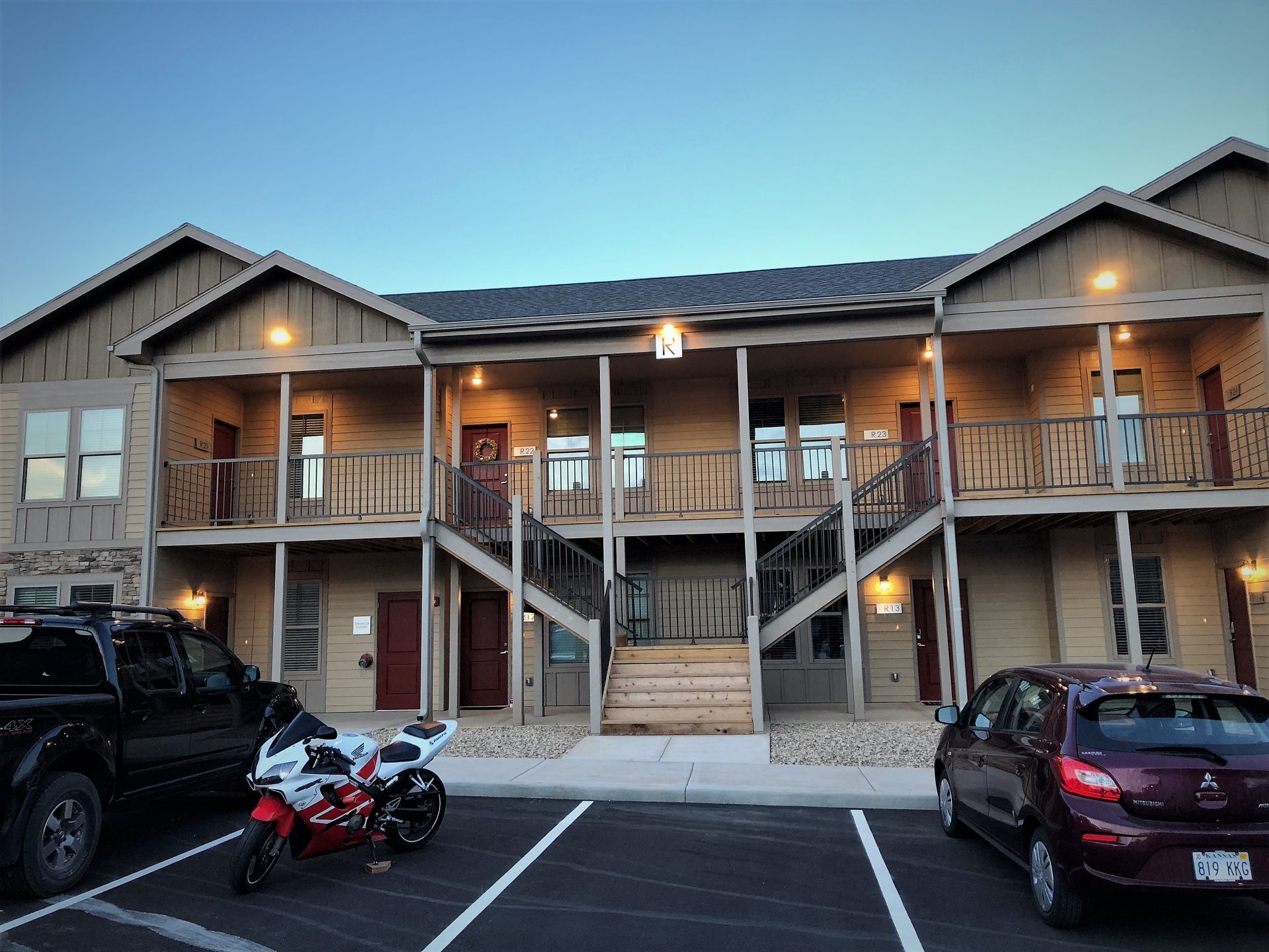 Kten place apartments at night with lights on in de soto, ks