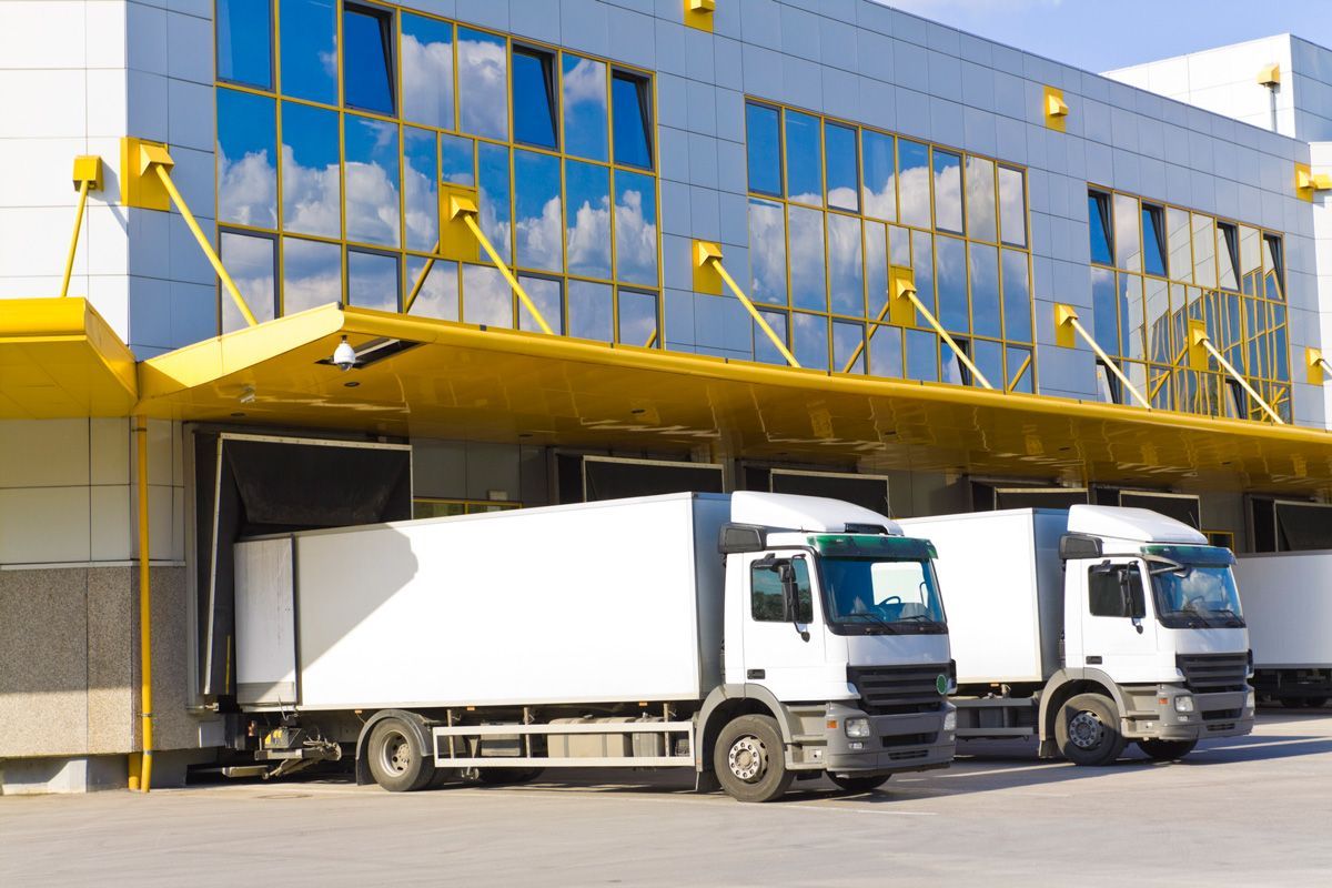 Trucks in Front of Modern Loading Docks — San Antonio, TX — C. M. Ruffo General Insurance