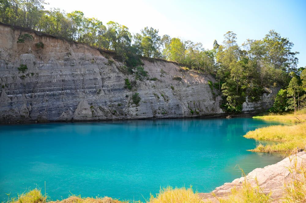 A Large Body Of Water Surrounded By Trees And Rocks — Brunswick Valley Door Centre in Lismore, NSW