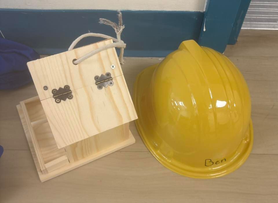 completed bird house and hard hat