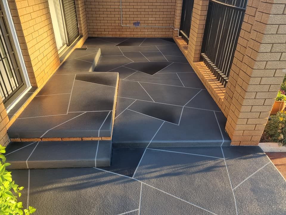 Dark Grey, Geometric Patterned Concrete Porch With Brick Accents — SRS Concreting In Glenvale, QLD