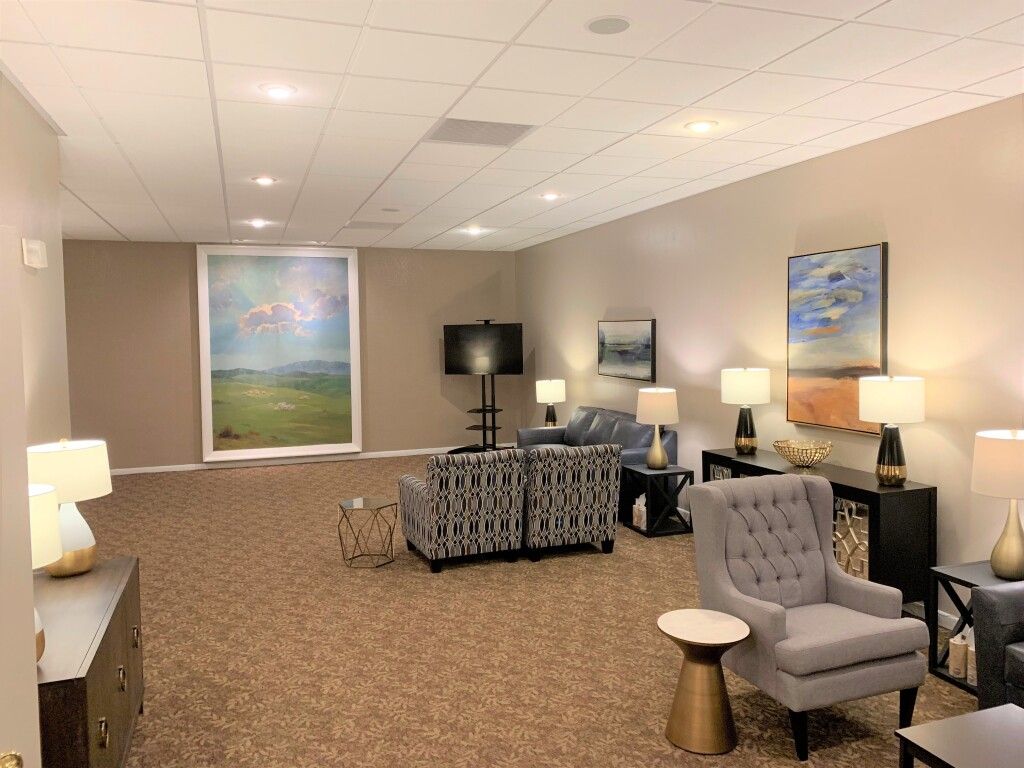 A living room filled with furniture and a television.