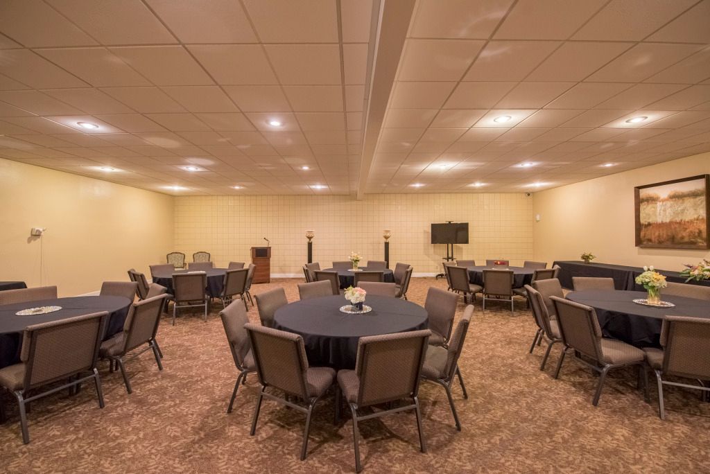 A large room filled with tables and chairs.