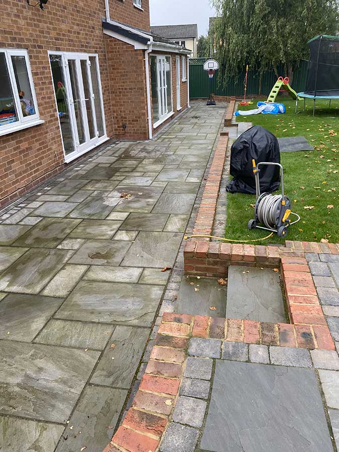 Solihull natural stone patio with green algae