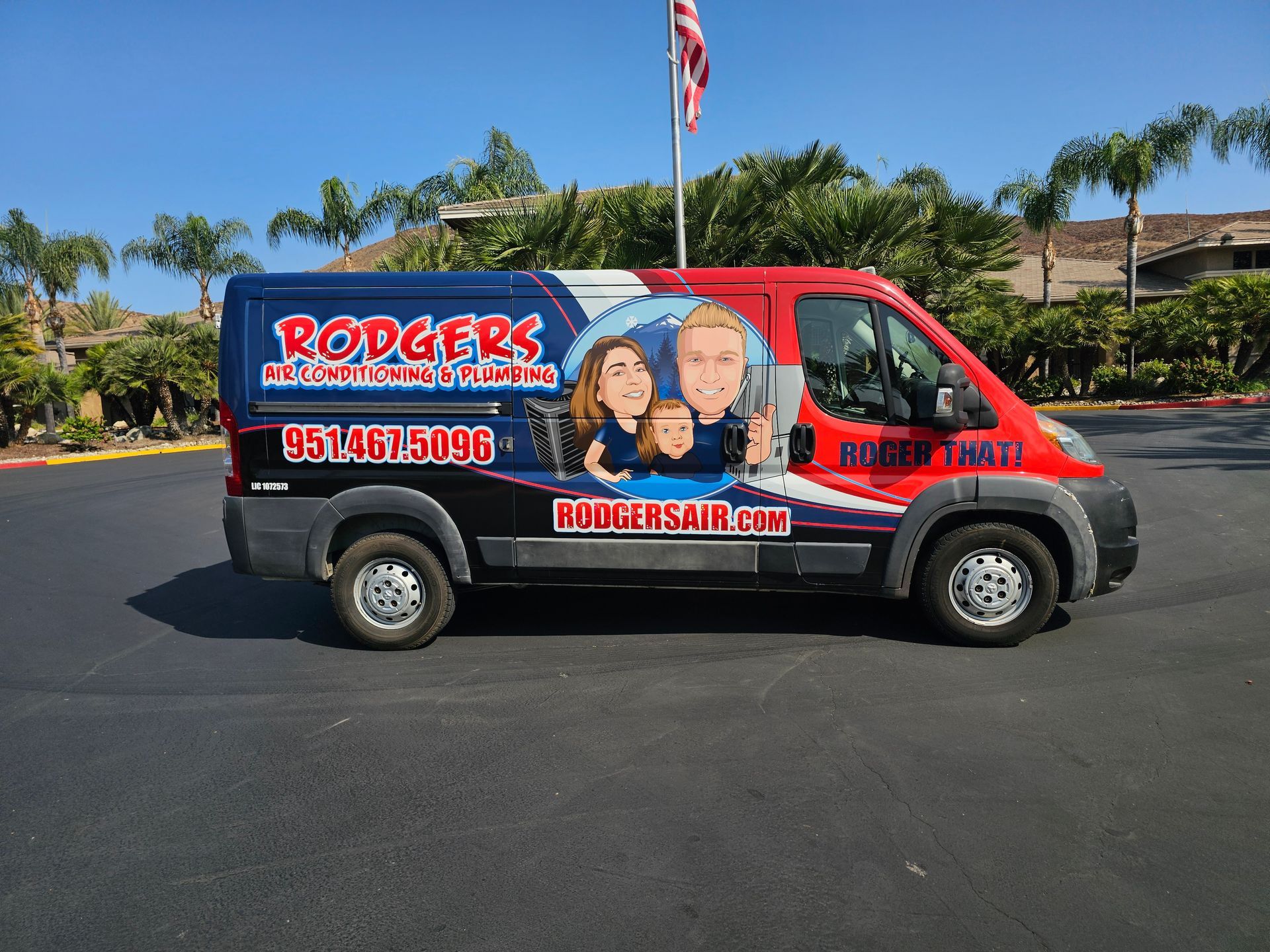 A rodgers van is parked in a parking lot