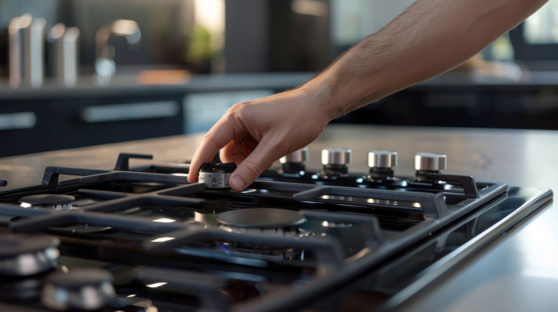 A person is adjusting a gas stove in a kitchen.