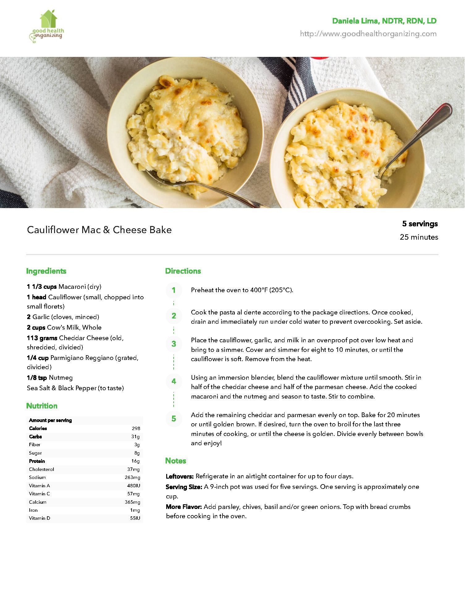 Two bowls of macaroni and cheese with spoons on a table.