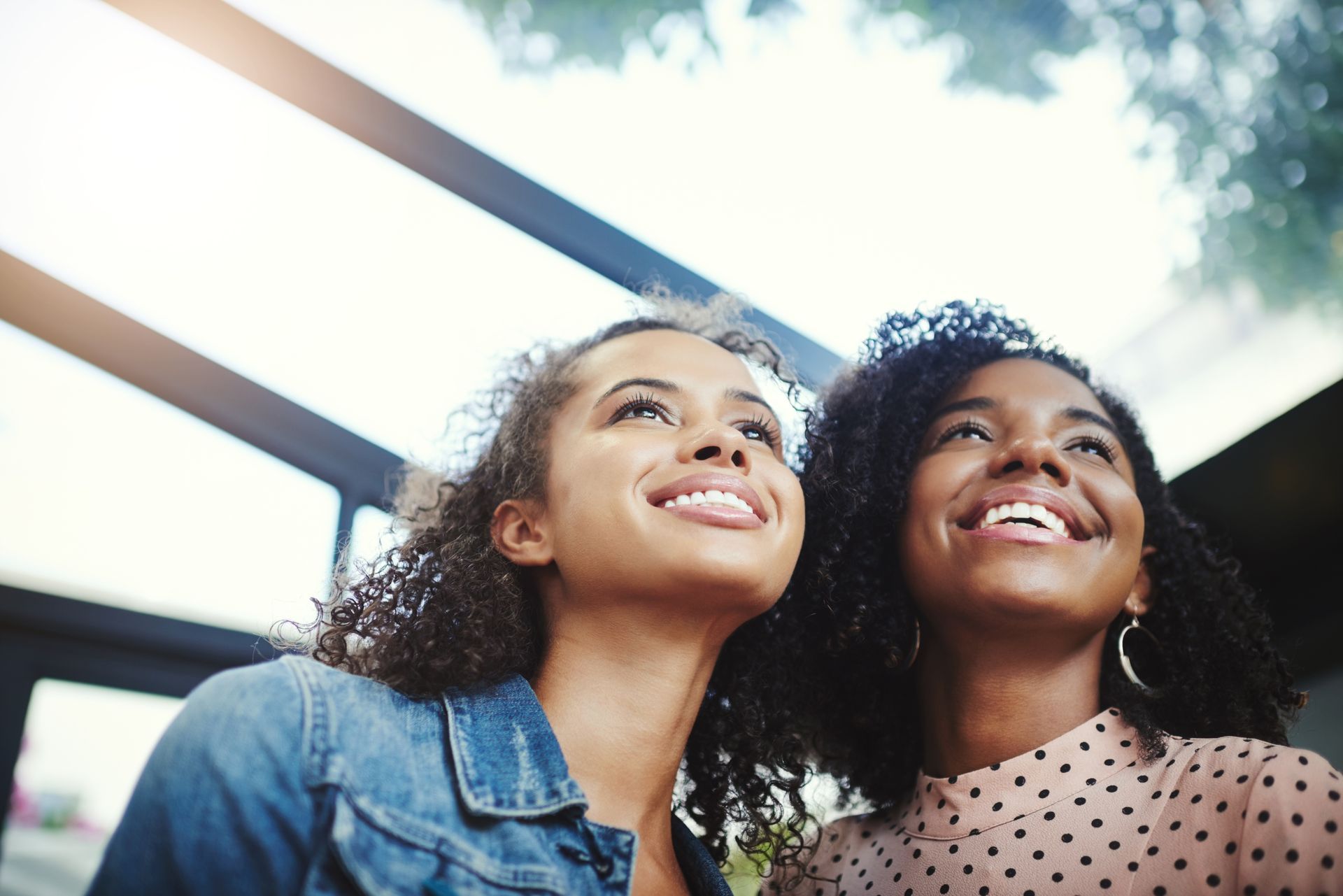 Person pointing to a document during a meeting, likely signing a contract.