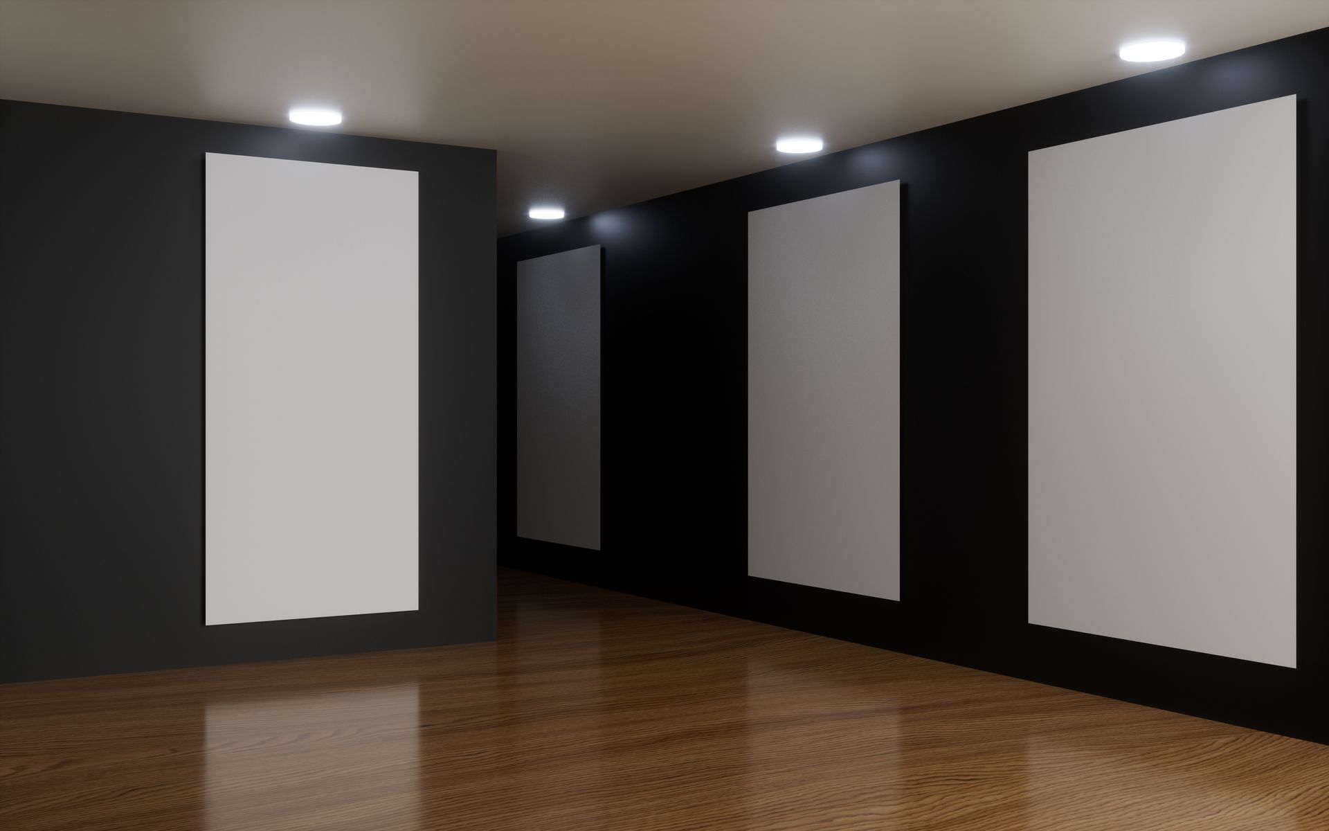 An empty room with three white posters on the wall.