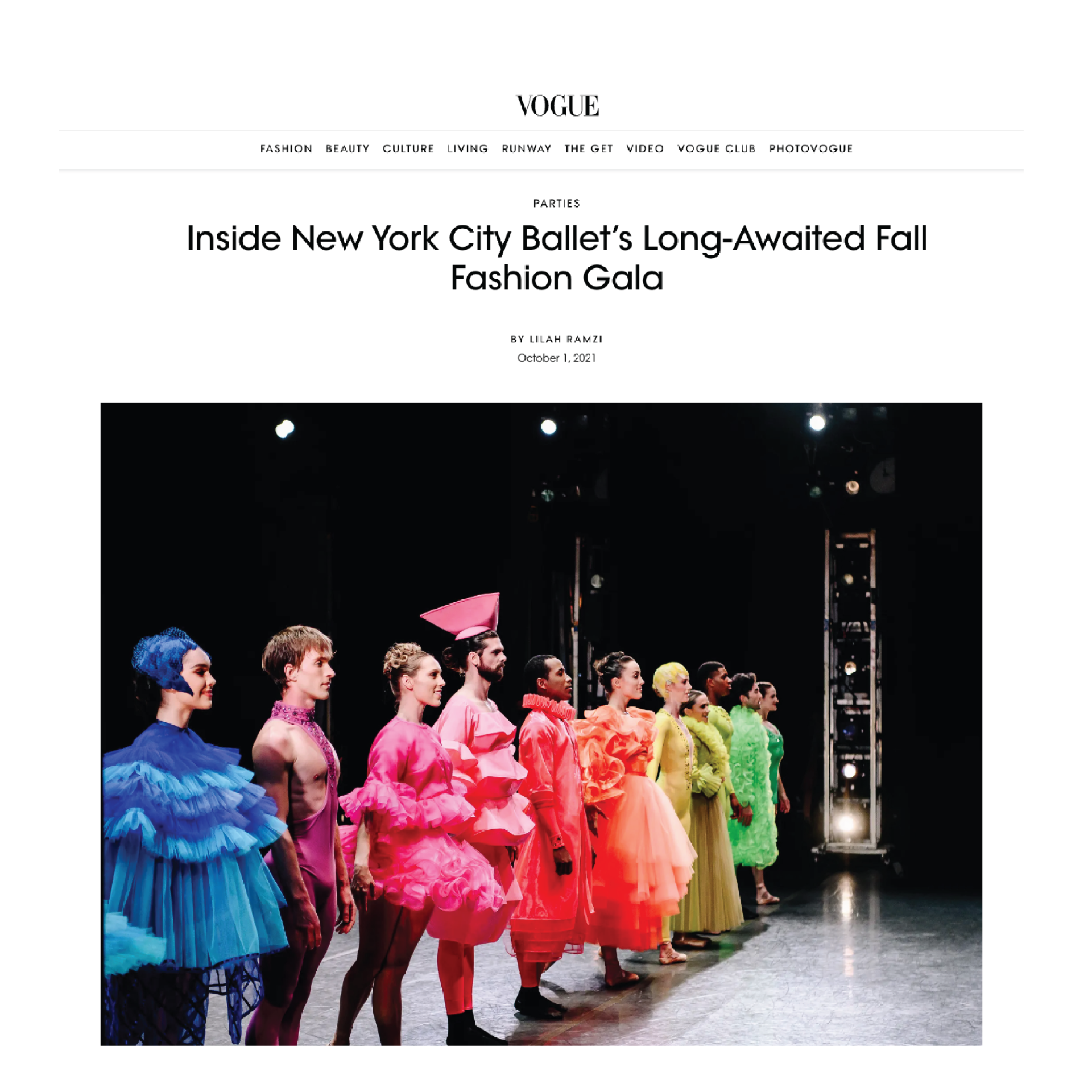 A group of people are standing next to each other on a stage.