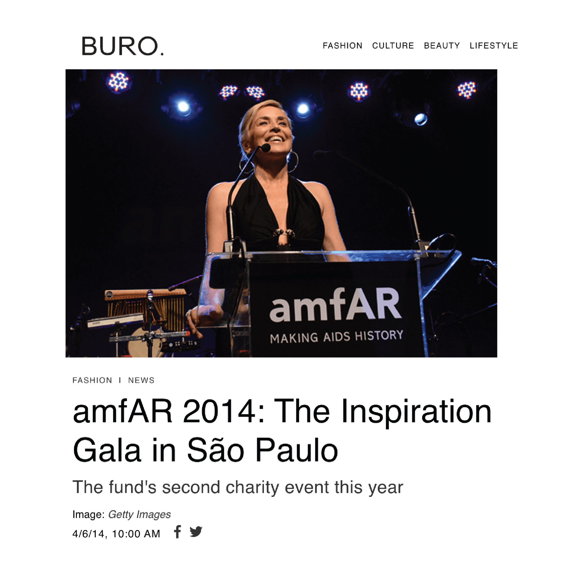 A woman is standing at a podium giving a speech at an amfar gala in sao paulo.