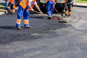 Workers on Asphalting road - Stripping in Glenwood, IA