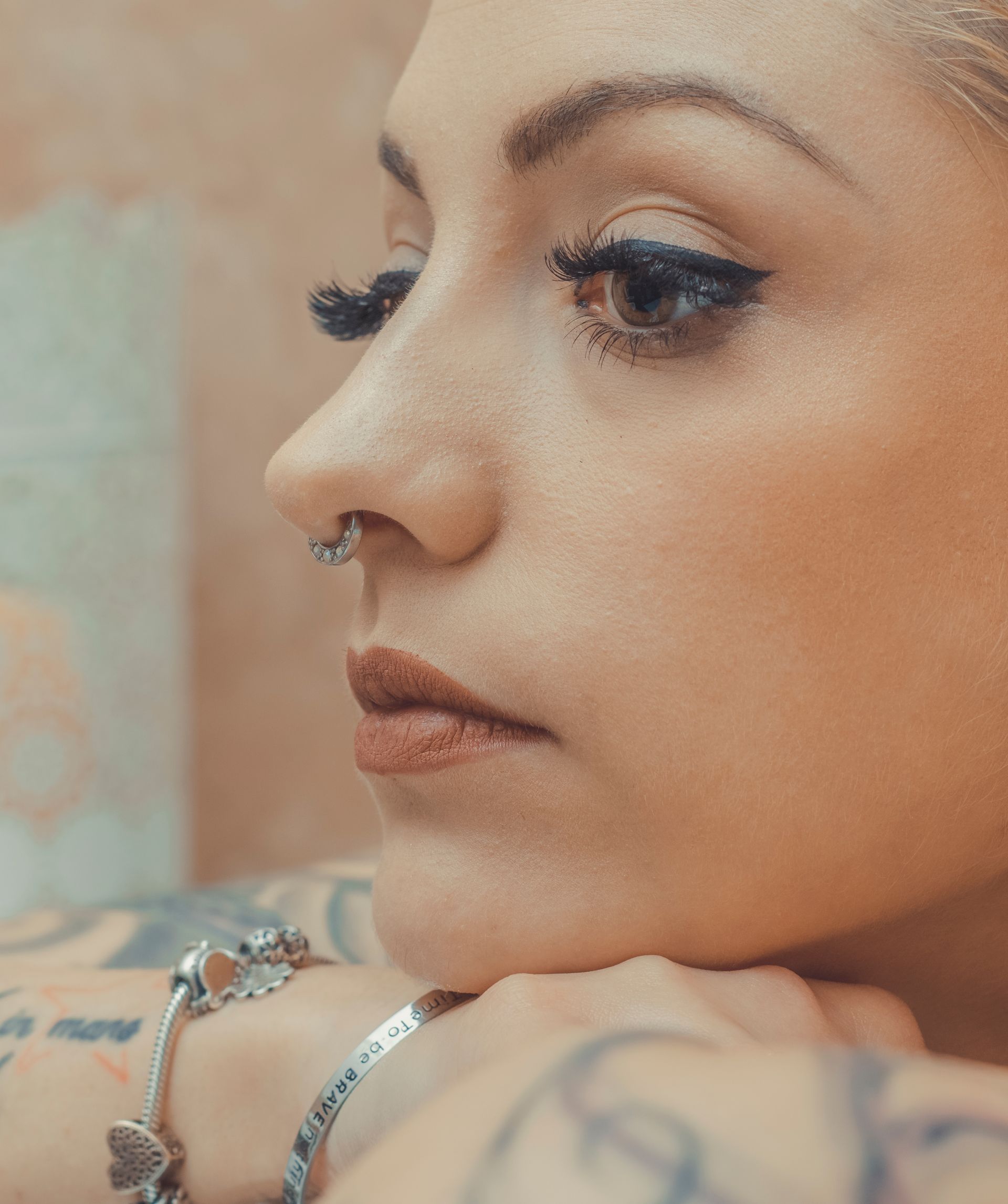 a woman wearing a nose piercing