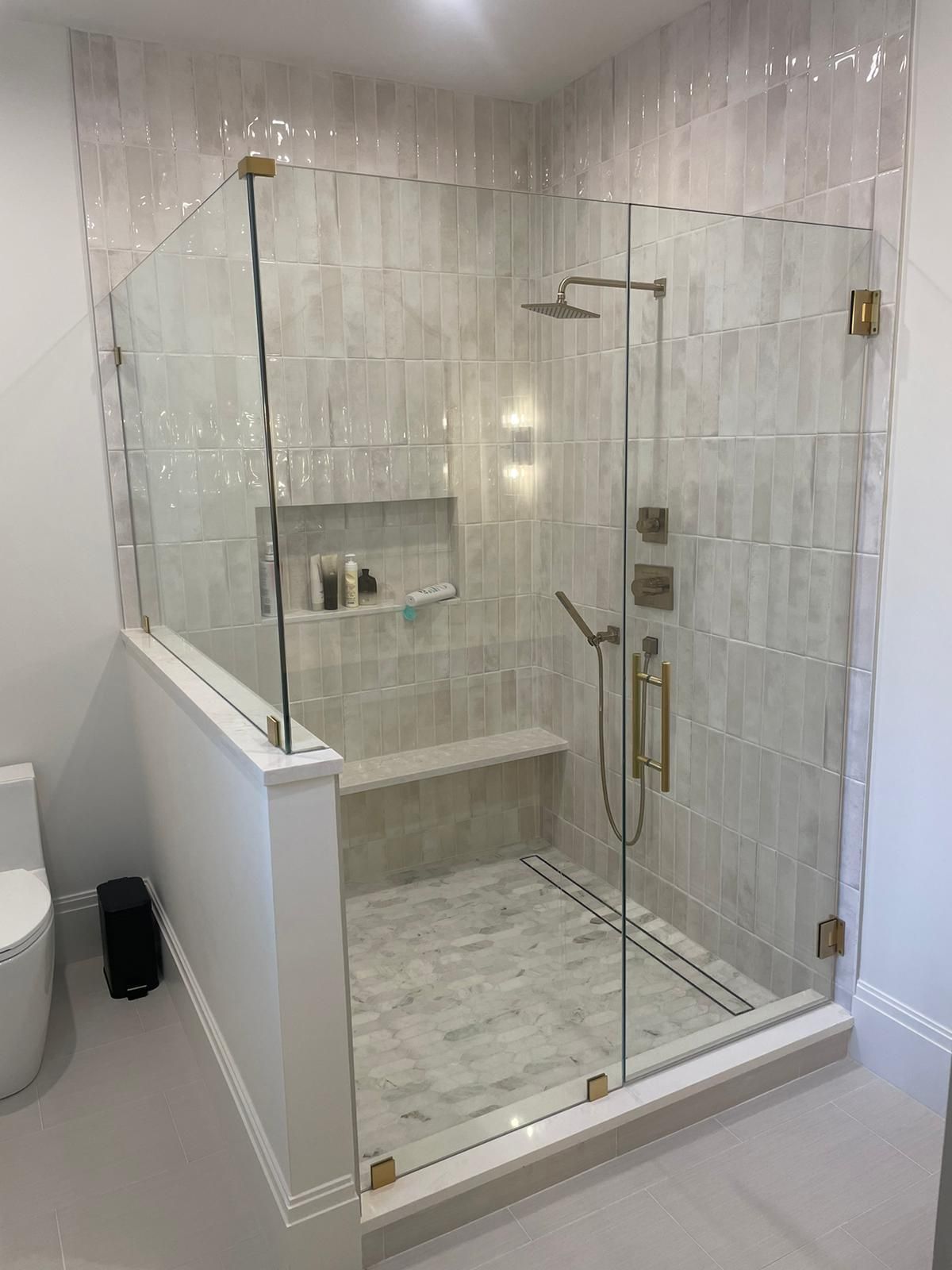 Elegant glass shower door adding a contemporary touch to the bathroom.