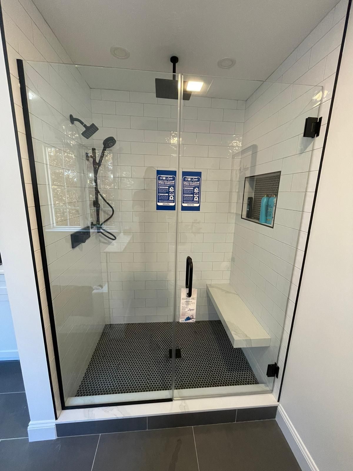 Shower glass doors providing a contemporary touch.