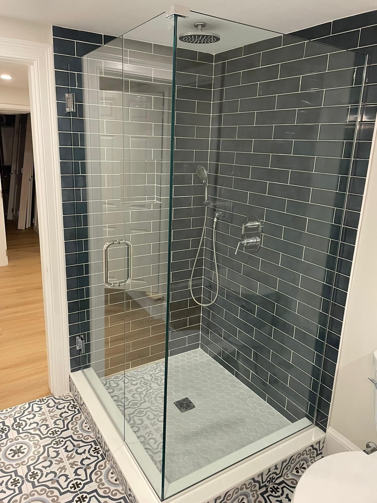 Shower enclosure with clean glass lines in a modern bathroom.