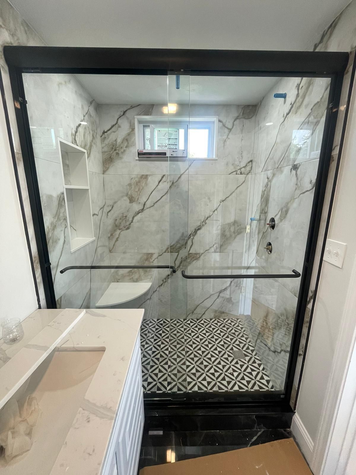 Elegant glass shower door adding a contemporary touch to the bathroom.