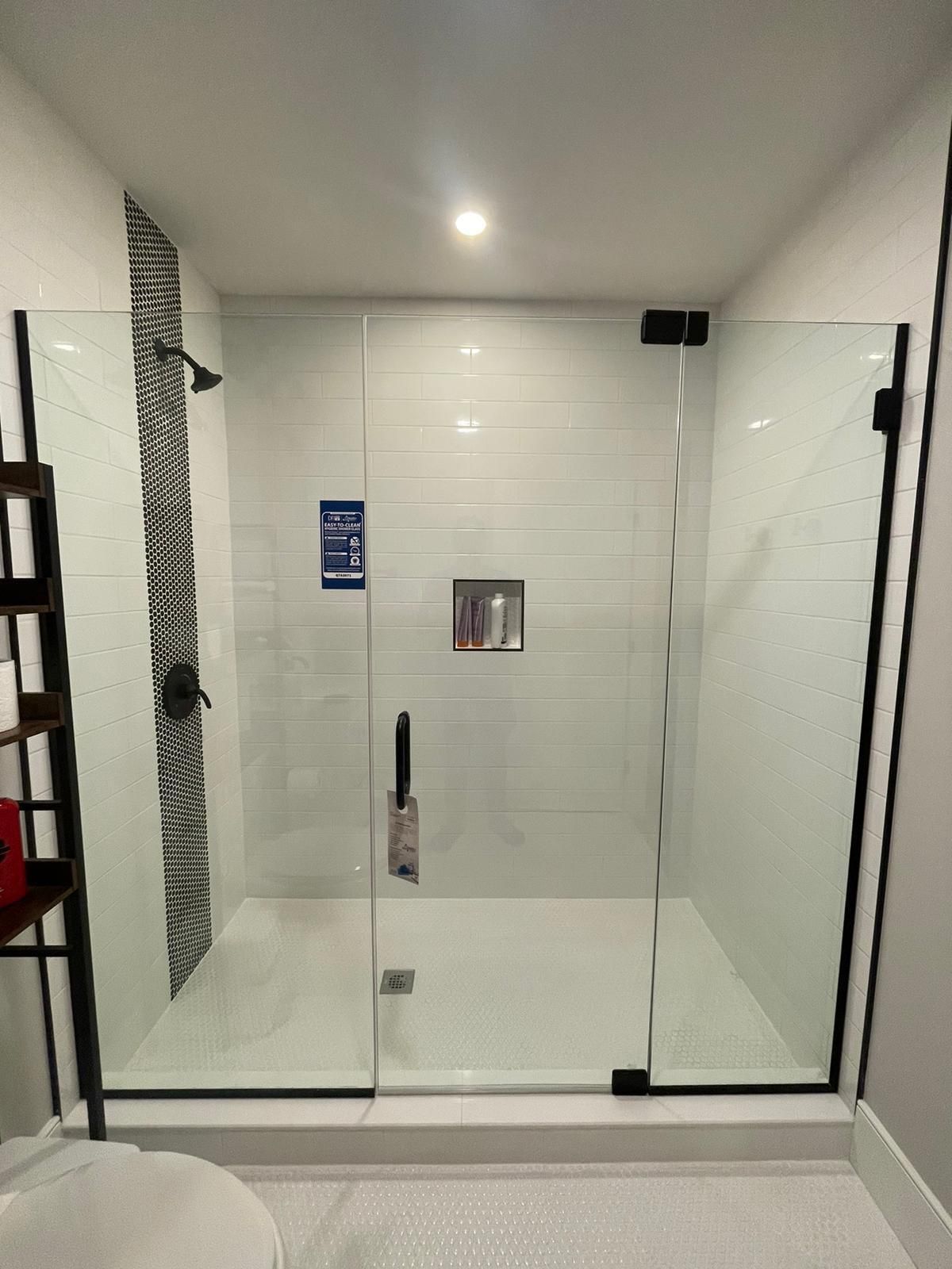 Transparent glass shower panels enhancing the bathroom design.