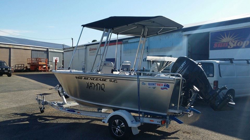 A Boat is Parked on a Trailer in Front of a Building — Custom Unique Trimming in Mackay, QLD