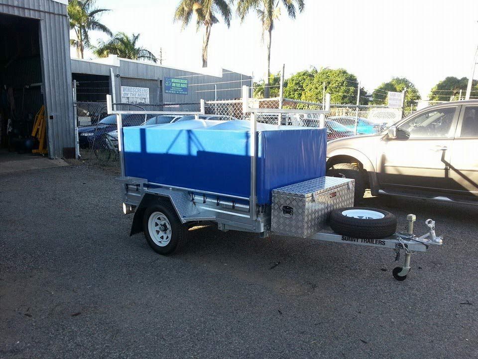 A Blue and White Trailer is Parked in a Parking Lot — Custom Unique Trimming in Mackay, QLD