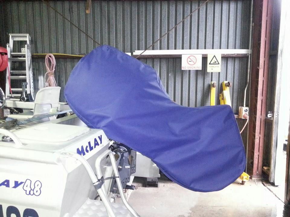 A Boat With a Blue Cover That Says Mclay on It — Custom Unique Trimming in Mackay, QLD