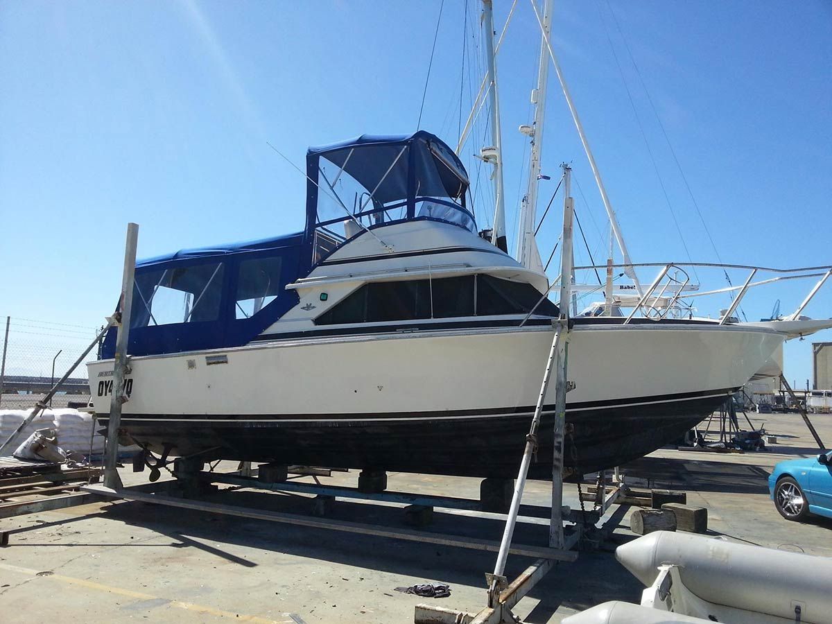 A Boat is Sitting on a Trailer in a Marina — Custom Unique Trimming in Mackay, QLD