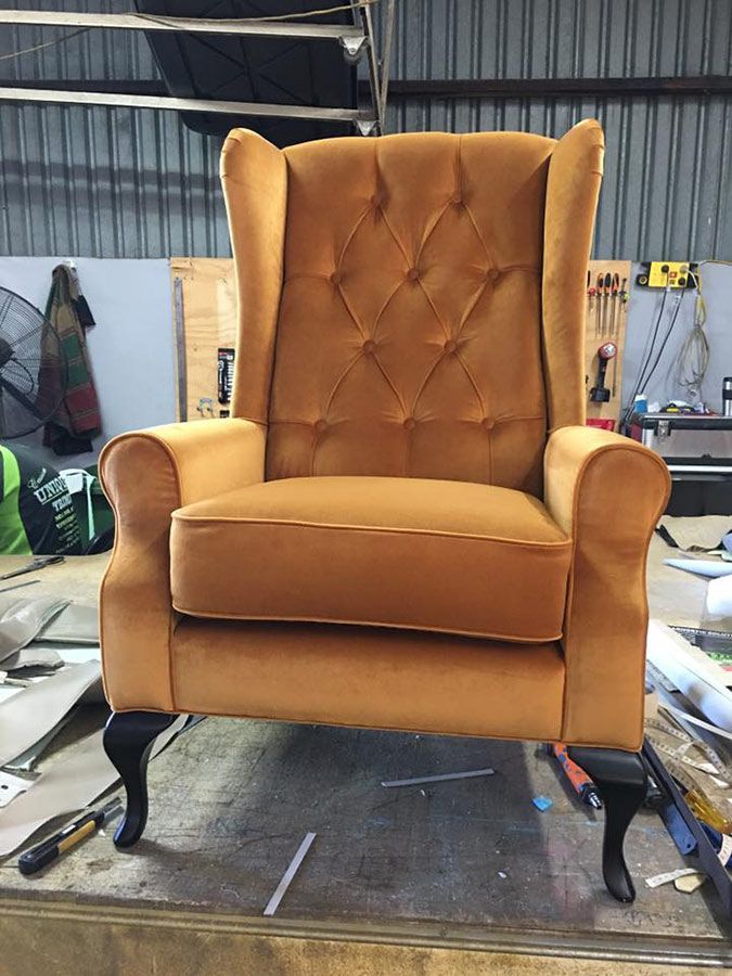 A Yellow Chair is Sitting on a Table in a Room — Custom Unique Trimming in Mackay, QLD
