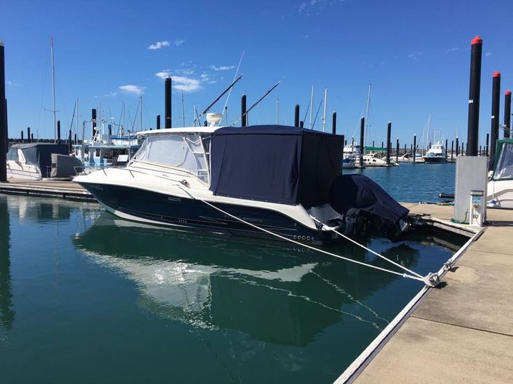 A Boat is Docked at a Marina on a Sunny Day — Custom Unique Trimming in Mackay, QLD