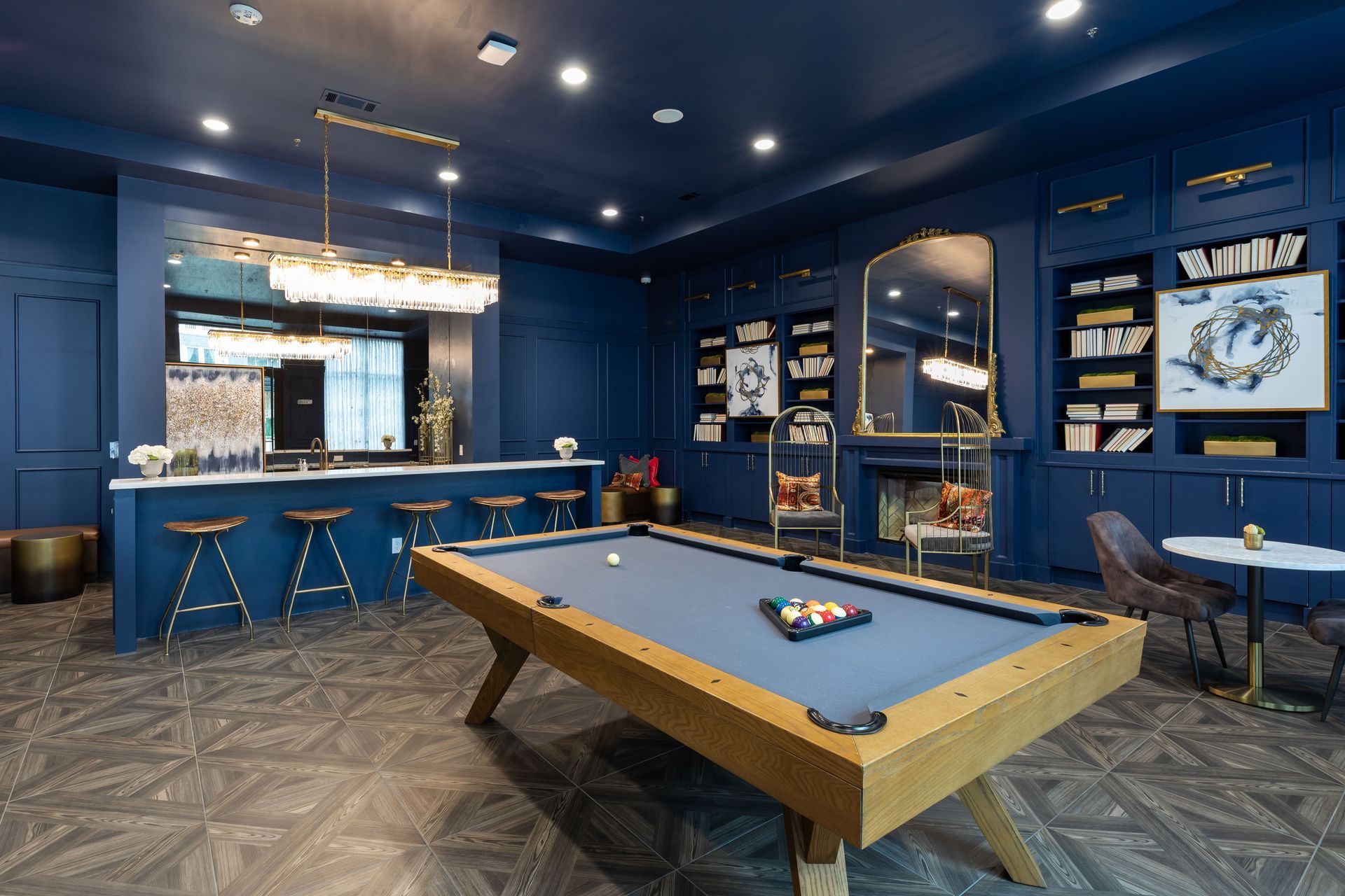 There is a pool table in the middle of the room.