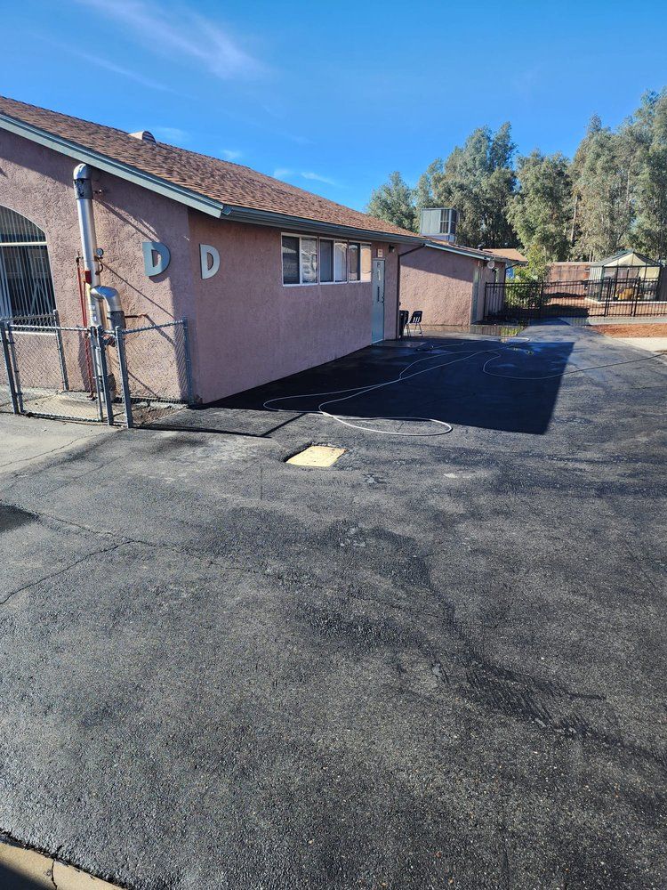 A house with a large driveway in front of it.