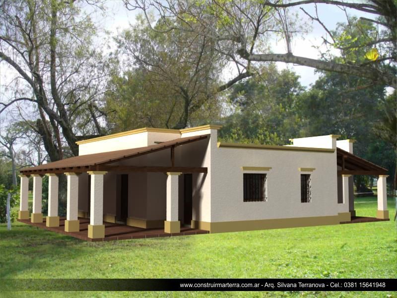 Casa de una sola planta color crema con porche y columnas, rodeada de árboles y césped