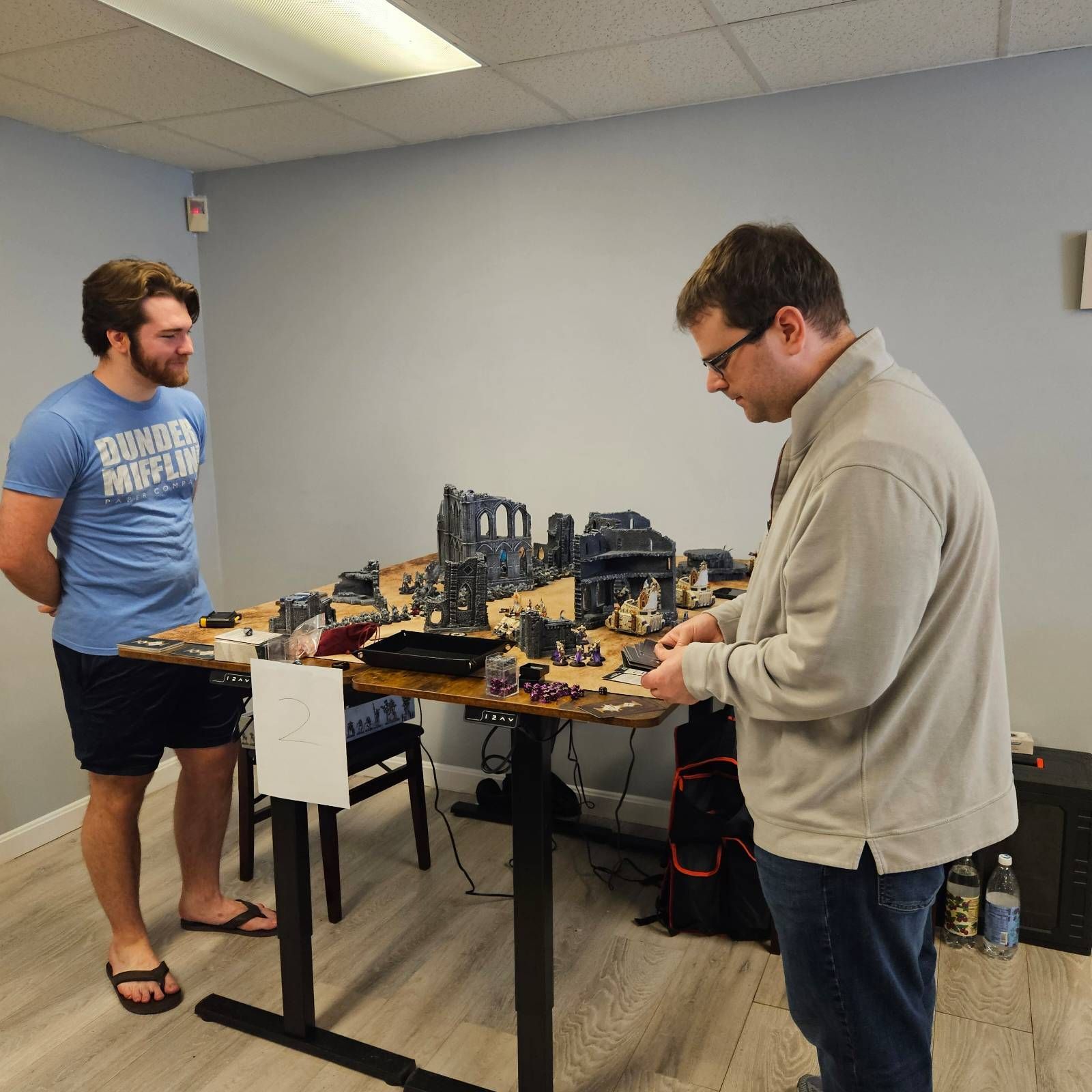 A man wearing a blue shirt that says thunder chasers on it