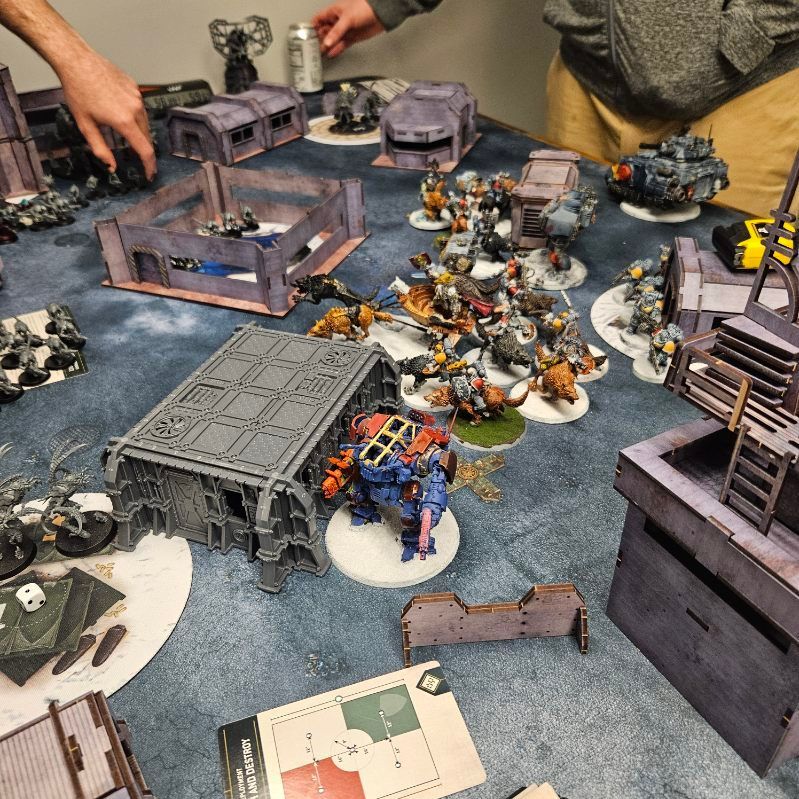 A table with a bunch of miniature figures on it