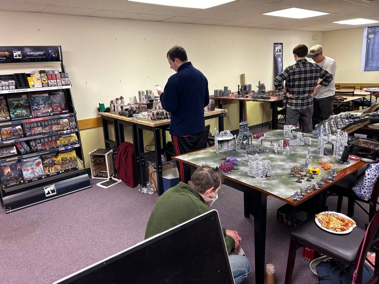 A group of people are playing a game in a room