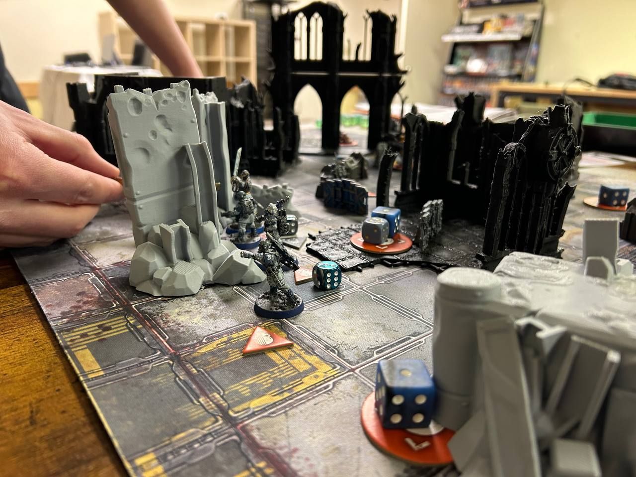 A person is playing a board game on a table.