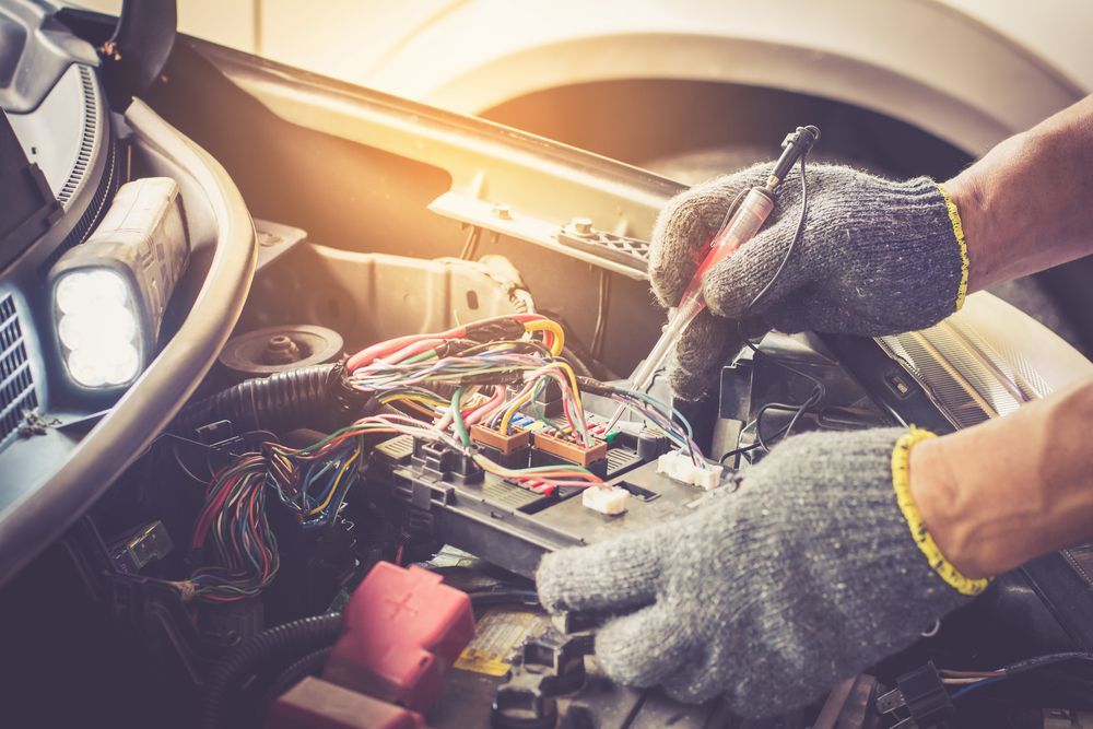 A Person is Working on the Engine of a Car — Port Service Centre In Port Macquarie, NSW