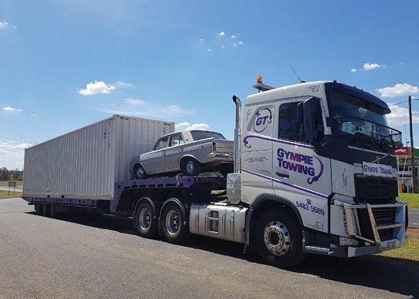 Fleet Carrying Car and Container — Gympie Towing in Kybong, QLD