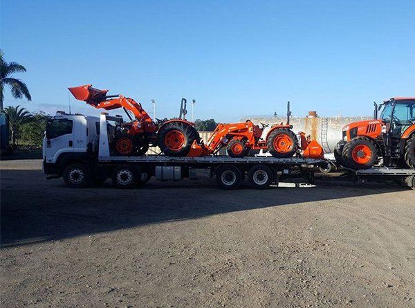 Tow Truck Transporting Machinery — Gympie Towing in Kybong, QLD